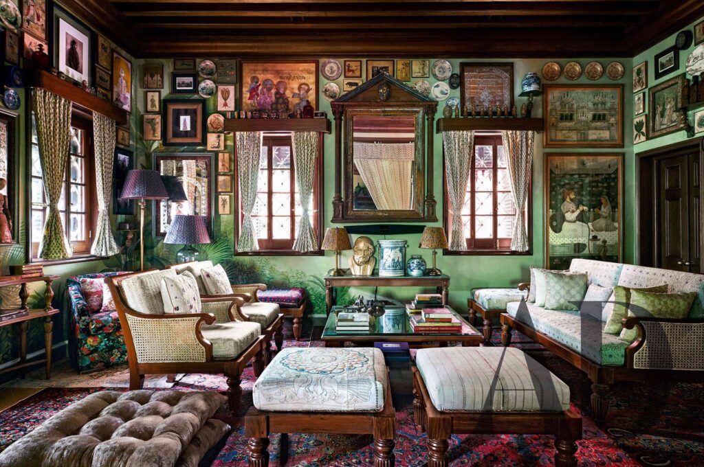Interior view of Sabyasachi Mukherjee Kolkata home showcasing maximalist décor, layered art, vintage antiques, bold wallpapers, and statement lighting.