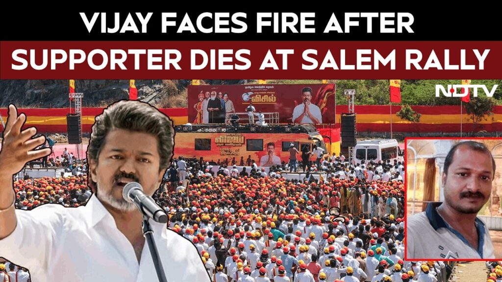Rally organizers and party leaders responding at the TVK rally in Salem after a man collapses and dies, showing emergency assistance and crowd management.